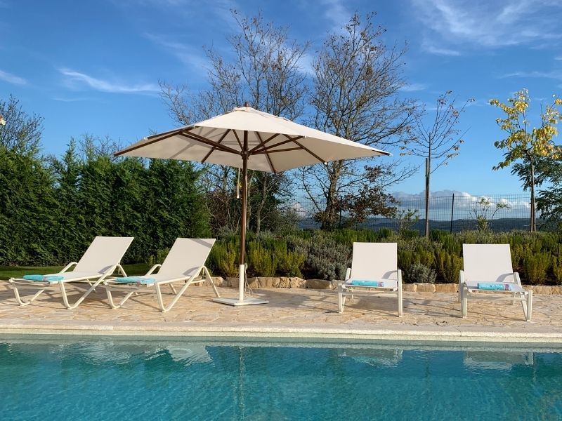 Pool and deck chairs at villa in Istria