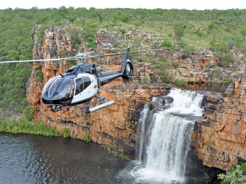 Take to the skies on a helicopter ride over King Cascade waterfall