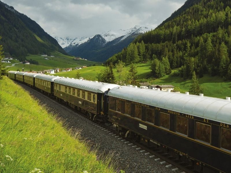 Take in the magnificent mountain scenery rolling past your window on the Venice Simplon Orient Express