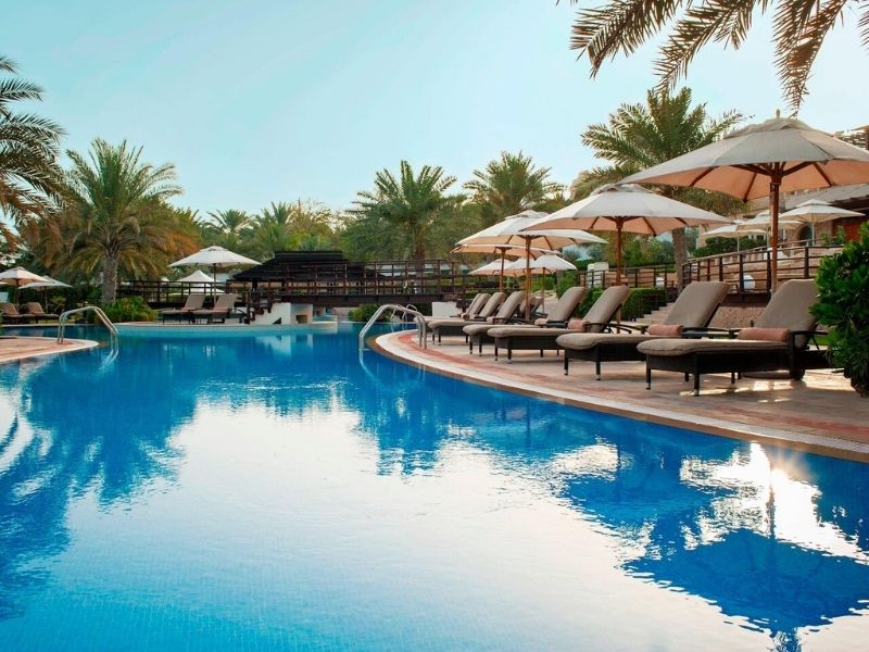 Relax by the pool at Westin Mina Seyahi during your luxury family holiday to Dubai