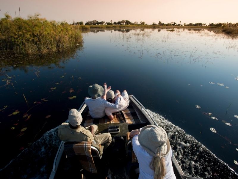 Enjoy boating excursions along the Okavango Delta during your luxury Botswana safari holiday
