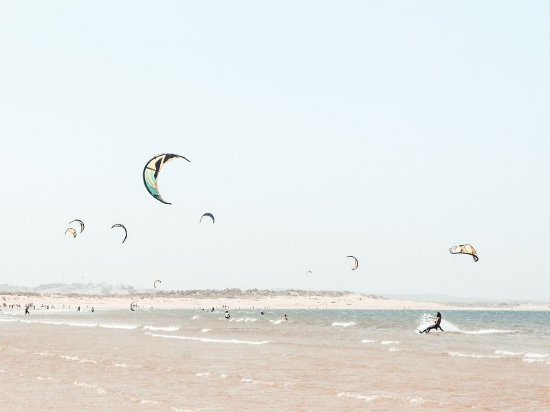 Kites on Essaouira beach during luxury holidays to Morocco