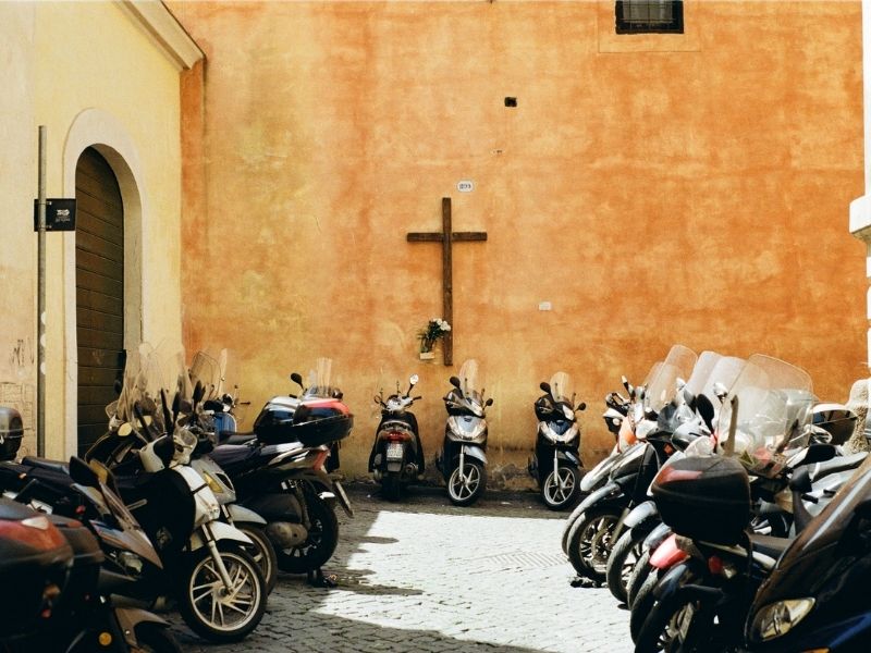 Explore the cobblestone streets of Rome by Vespa