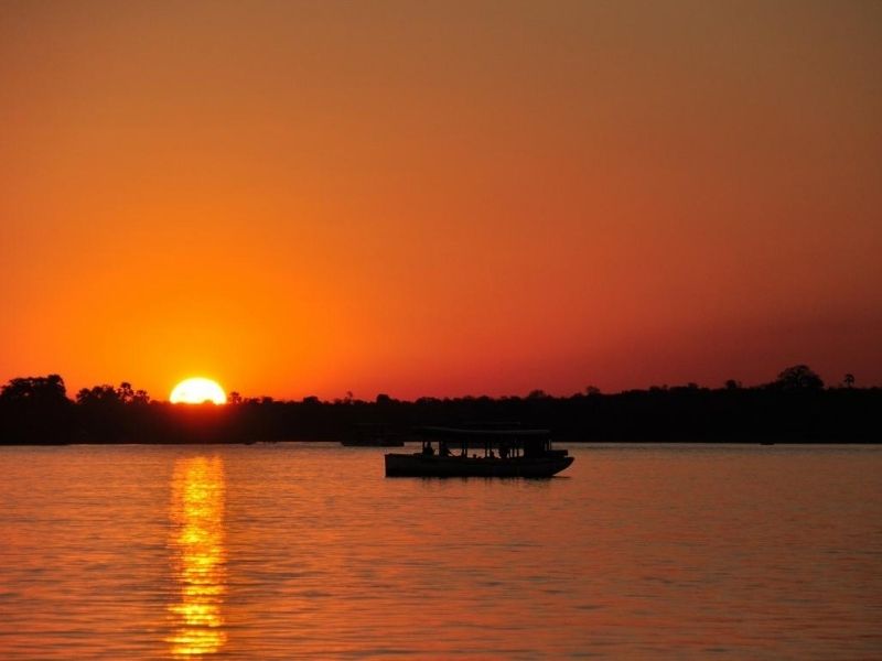 Enjoy a sunset cruise along the Zambezi river on your luxury African holiday